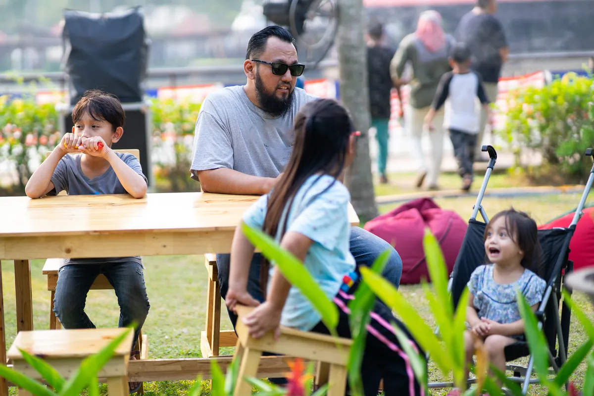 A father and children spending time together in a park